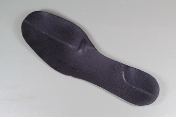 Black orthopedic shoe insole made in leather