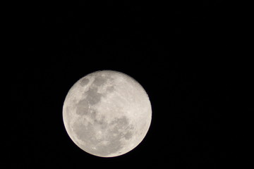 First moon after the full moon with distinct craters visible on the upper edge