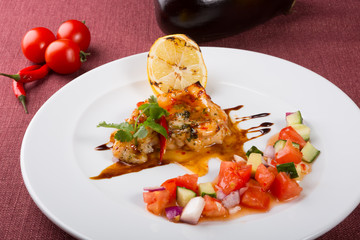 Grilled white fish fillet with vegetable salad
