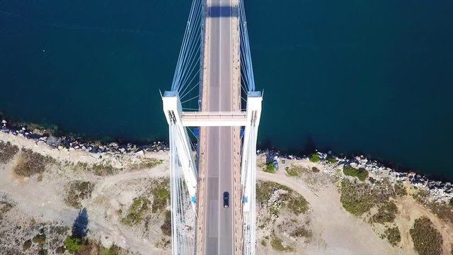 Aerial drone video of new famous public strait cable bridge of Halkida or Chalkida connecting mainland with Evoia island, Greece