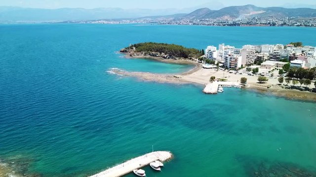 Aerial drone video of famous lighthouse built in small island and town of Halkida, Evoia island, Greece
