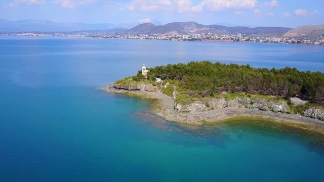 Aerial drone video of famous lighthouse built in small island and town of Halkida, Evoia island, Greece