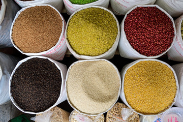 Bags of rice, beans and seeds on vietnameese market