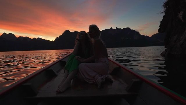 Women and sunset Cheow Lan lake