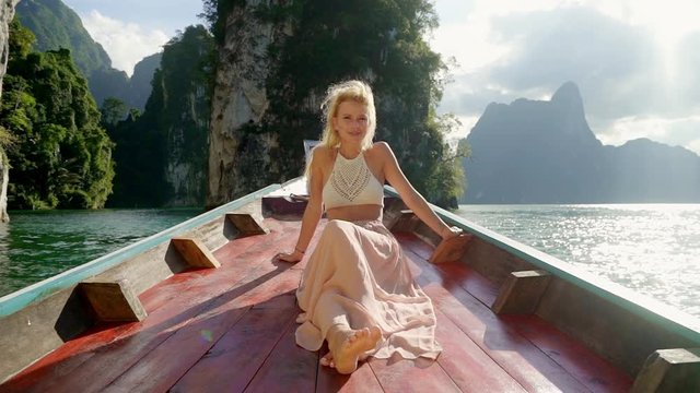 Single lady enjoying boat ride on Cheow Lan lake