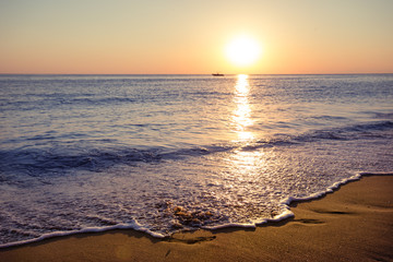 Fototapeta na wymiar Sandy beach at sunset