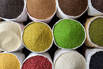 Bags of rice, beans and seeds on vietnameese market