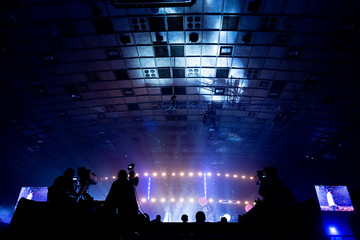 Television broadcast by a cameraman during a concert. Camera with the operator is on the high platform.