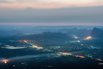 Street lights and small town at dawn with mountain range