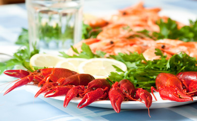 cooked shrimp and crayfish on plate close up