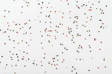 top view of colorful spices on white background