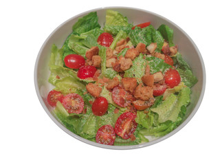 Vegetables with Caesar salad source on isolate white background with in clipping path.