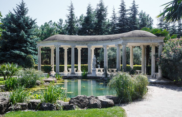 Antique-style gazebo in an olive grove near the pond, Crimea
