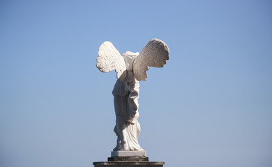Statue of Winged Victory of Samothrace (called Nike of Samothrace) in the Park Aivazovsky in Crimea  - obrazy, fototapety, plakaty
