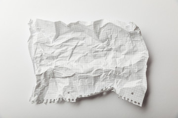 top view of blank squared crumpled page on white background