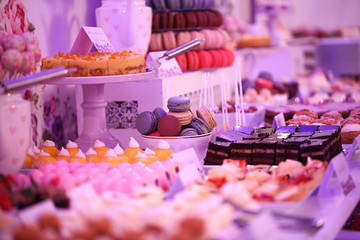 Delicious candy bar with macarons, cupcakes, cake pop and other sweets