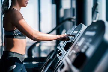 Starting cardio workout on a treadmill.