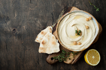 Homemade hummus with thyme, olive oil. Middle Eastern traditional and authentic arab cuisine. Top...