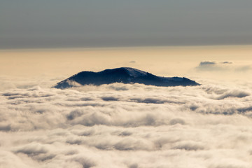 mountain top surrounded in mist