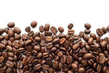 Roasted coffee beans isolated on white background. Close-up.