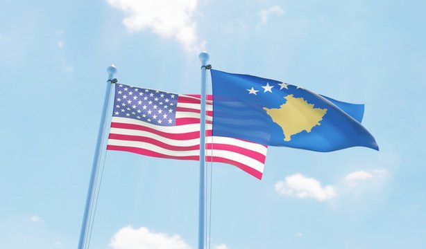 Kosovo and USA, two flags waving against blue sky. 3d image