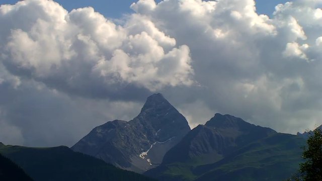 Summer landscape with mountains and clouds - time lapse