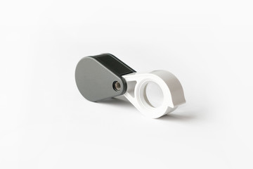 Magnifying glass for diamonds or see the amulet Isolated on a White Background.