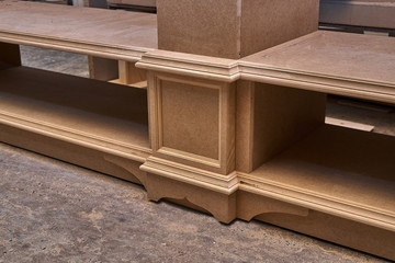 Mdf cabinet carcass. Home library with classic design. Wooden furniture manufacturing process