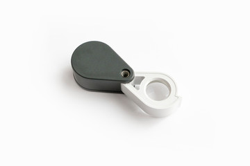 Magnifying glass for diamonds or see the amulet Isolated on a White Background.