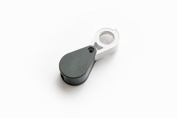 Magnifying glass for diamonds or see the amulet Isolated on a White Background.
