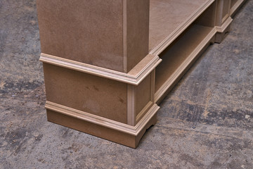 Mdf cabinet carcass. Home library with classic design. Wooden furniture manufacturing process