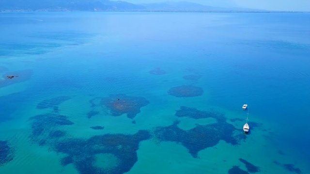Aerial view video from famous organised beach in small island of Monolia part of archipelago paradise exotic islands of Lihadonisia with clear turquoise sea beaches, North Evoia island, Greece