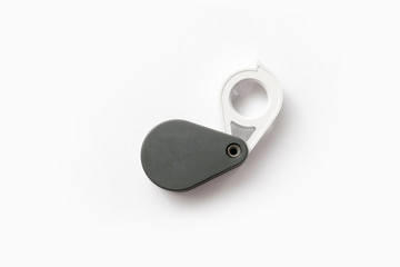 Magnifying glass for diamonds or see the amulet Isolated on a White Background.