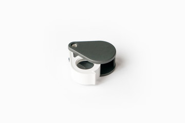 Magnifying glass for diamonds or see the amulet Isolated on a White Background.