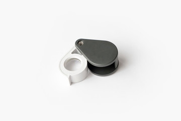 Magnifying glass for diamonds or see the amulet Isolated on a White Background.