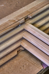 Wooden cabinet doors. Wooden frame. Home library with classic design. Wooden furniture manufacturing process
