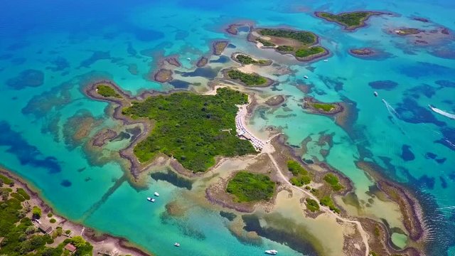 Aerial view video from famous organised beach in small island of Monolia part of archipelago paradise exotic islands of Lihadonisia with clear turquoise sea beaches, North Evoia island, Greece