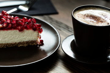 Latte served with cheesecake 