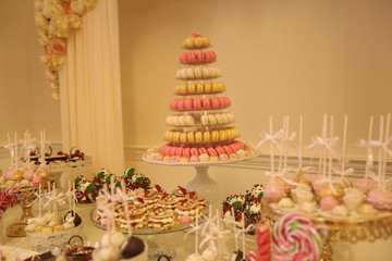 Delicious candy bar with macarons, cupcakes, cake pop and other sweets