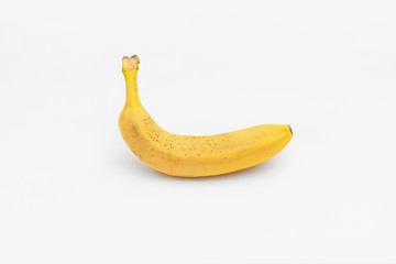 Single yellow ripe banana isolated on white background. Fiber fruits