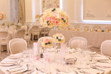 Elegant wedding reception table arrangement, floral centerpiece