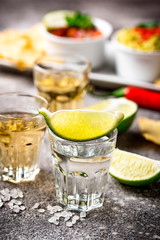 Shots of silver and gold tequila