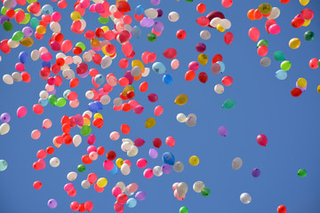 Colorful balloons in the blue spring sky.