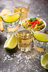 Shots of silver and gold tequila