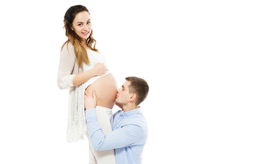 Beautiful Happy Young Couple Expecting Baby - Man Kissing Pregnant Belly