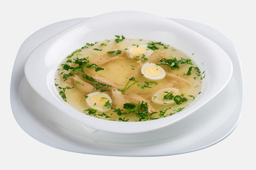 Chicken broth with quail eggs and crackers.
