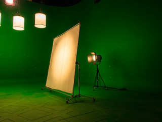 Modern TV Studio Green Screen chroma key background with camera and Light Equipment