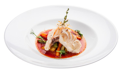 Smoked mackerel with vegetables and sauce. On white background