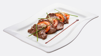 Beaten fried veal with tomatoes on white background