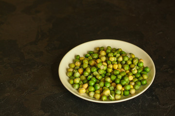 peas green seedling of grain (seedlings in the ground, watered) petals and stems. Food background